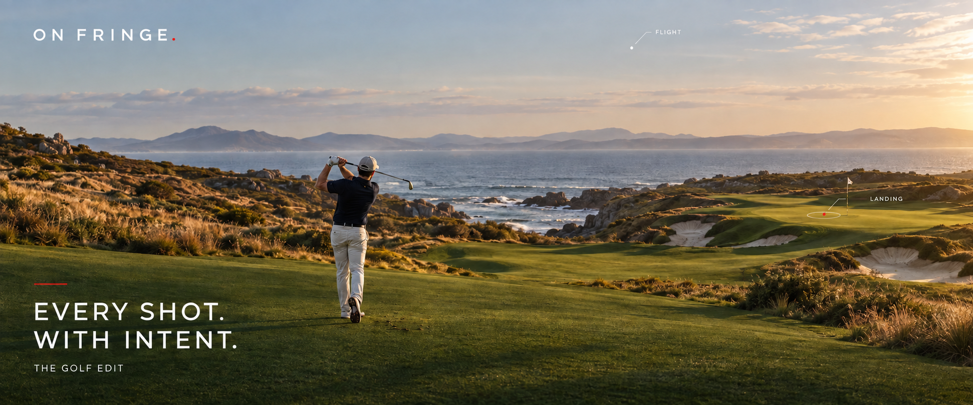 A golfer finishes a shot on a sunlit coastal course, looking towards the green.
